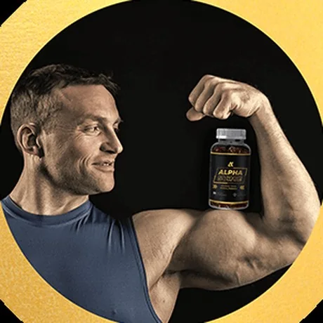 Man holding a bottle of Alpha Surge gummies